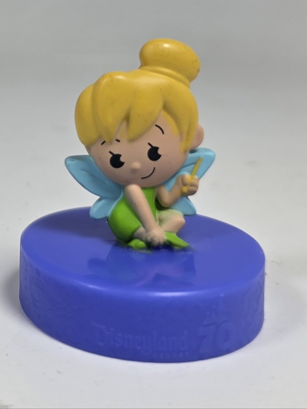 This item is a Tinker Bell figure from the McDonald's Disneyland 70th Anniversar